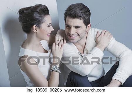 Beautiful young woman looking at her husband View Large Photo Image Stock Photography - Beautiful young woman looking at her husband. Fotosearch