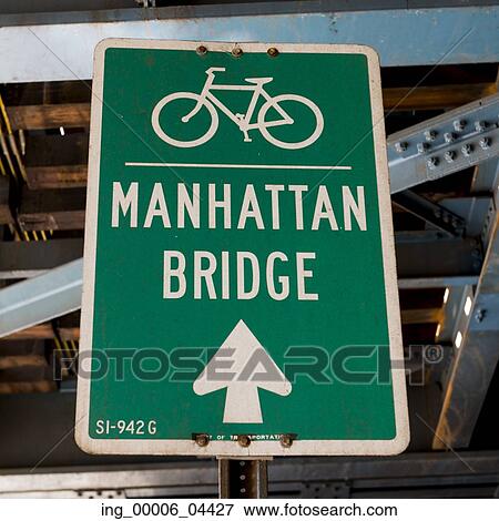 Stock Photo - Bicycle lane direction sign to the Manhattan Bridge in Manhattan, New York City, New York State, USA. Fotosearch