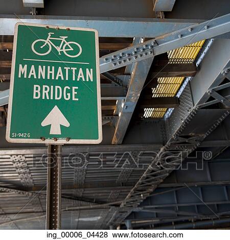 Stock Photo - Bicycle lane direction sign to the Manhattan Bridge in Manhattan, New York City, New York State, USA. Fotosearch