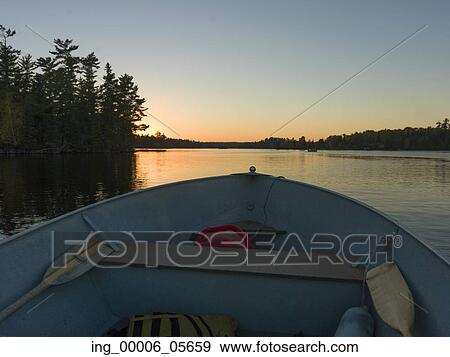 Stock Photo - Bow front view of a canoe in Lake Of The Woods, Ontario, Canada. Fotosearch