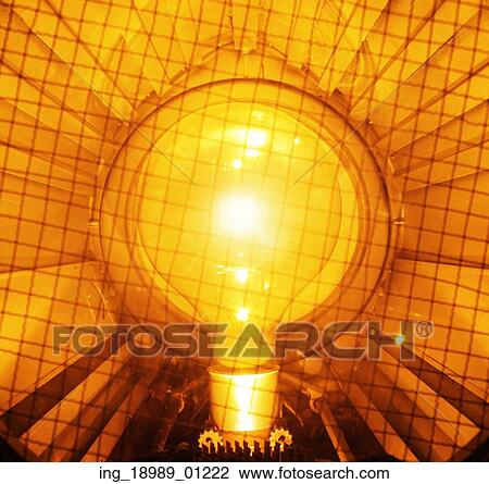 Bright and yellow light bulb View Large Photo Image Stock Image - Bright and yellow light bulb. Fotosearch