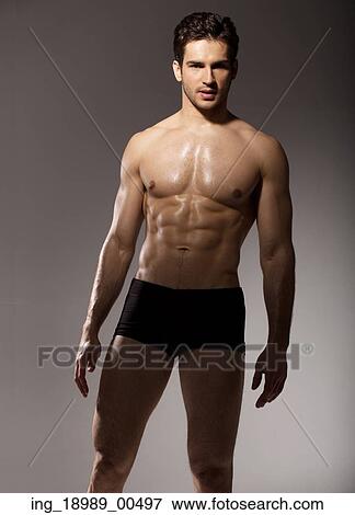 Stock Photo - Brunette man with muscular body. Fotosearch