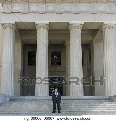 Businessman standing on stairs, Valparaiso, Chile View Large Photo Image Stock Photo - Businessman standing on stairs, Valparaiso, Chile. Fotosearch