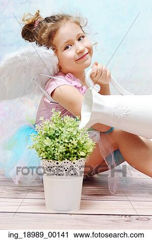 Calm and cute child dressed up as witch View Large Photo Image Stock Image - Calm and cute child dressed up as witch. Fotosearch