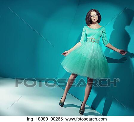 Stock Photography - Candy lady wearing bright green dress. Fotosearch