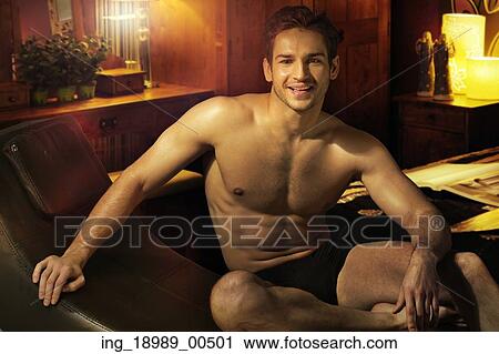 Cheerful muscular man in his place View Large Photo Image Stock Image - Cheerful muscular man in his place. Fotosearch