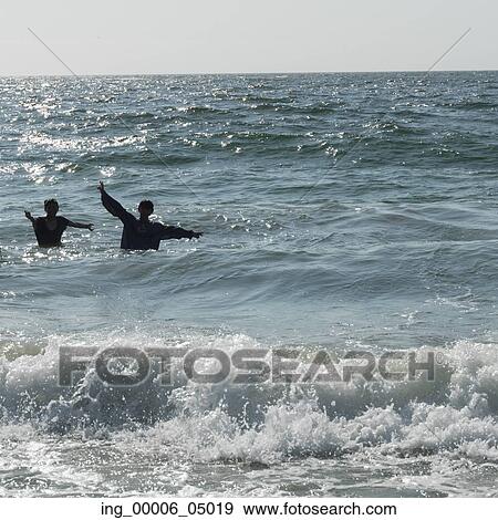 Stock Photo - Children playing in sea, Vina Del Mar, Chile. Fotosearch