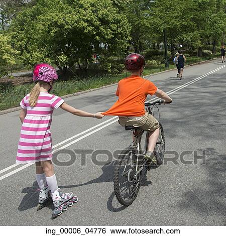 Children skating and cycling in Central Park, Manhattan, New York City, New York State, USA View Large Photo Image Stock Photograph - Children skating and cycling in Central Park, Manhattan, New York City, New York State, USA. Fotosearch