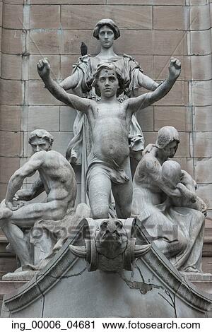 Stock Image - Close-up of statues by wall, Manhattan, New York City, New York State, USA. Fotosearch