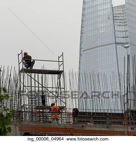 Construction workers working at construction site, Santiago, Santiago Metropolitan Region, Chile View Large Photo Image Picture - Construction workers working at construction site, Santiago, Santiago Metropolitan Region, Chile. Fotosearch