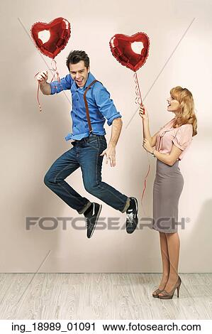 Stock Image - Cute blonde woman with her valentine&rsquo; s boyfriend. Fotosearch