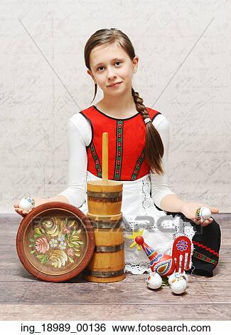 Cute girl in a beautiful national costume View Large Photo Image Stock Photograph - Cute girl in a beautiful national costume. Fotosearch