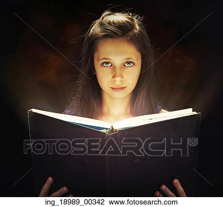Cute girl opening the magic book View Large Photo Image Stock Image - Cute girl opening the magic book. Fotosearch