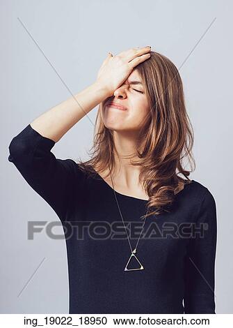 Cute girl remembered something and holding his head View Large Photo Image Stock Image - Cute girl remembered something and holding his head. Fotosearch