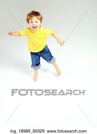 Stock Photo - Cute litle child having a great fun. Fotosearch