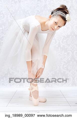 Stock Photo - Cute little ballerina before crucial performance. Fotosearch