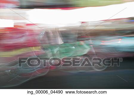 Defocused view of people cycling, Times Square, Manhattan, New York City, New York State, USA View Large Photo Image Stock Image - Defocused view of people cycling, Times Square, Manhattan, New York City, New York State, USA. Fotosearch
