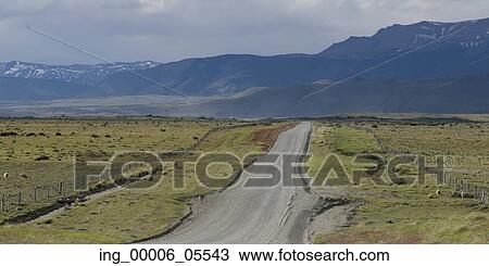 Stock Image - Dirt road passing through a landscape, Torres Del Paine National Park, Patagonia, Chile. Fotosearch
