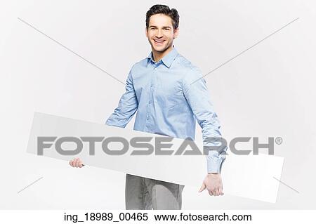 Stock Photography - Elegant man with the empty white board. Fotosearch