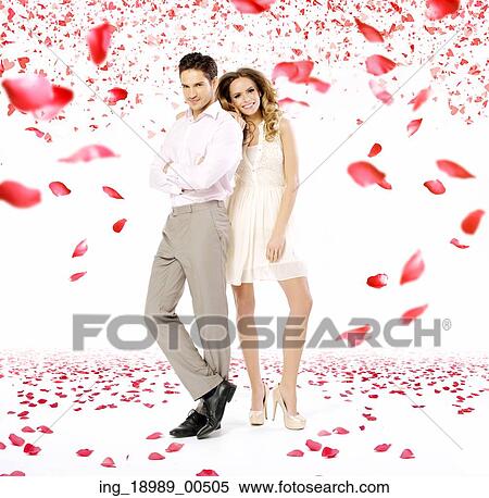 Elegant young couple in the rose petal rain View Large Photo Image Stock Photography - Elegant young couple in the rose petal rain. Fotosearch