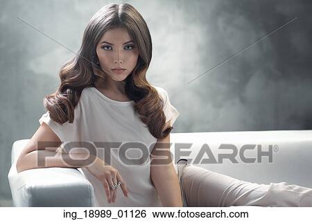 Elegant young lady with excellent classic hairstyle View Large Photo Image Stock Photograph - Elegant young lady with excellent classic hairstyle. Fotosearch