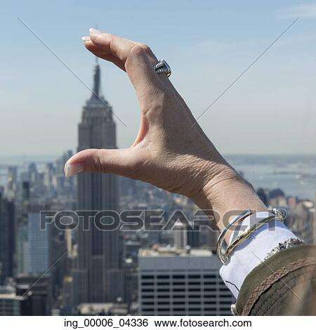 Empire State Building in the hand from Top of the Rock observation deck, Midtown Manhattan, New York City, New York State, USA View Large Photo Image Stock Photograph - Empire State Building in the hand from Top of the Rock observation deck, Midtown Manhattan, New York City, New York State, USA. Fotosearch