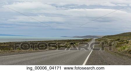 Empty road passing through coast, Santa Cruz Province, Patagonia, Argentina View Large Photo Image Stock Image - Empty road passing through coast, Santa Cruz Province, Patagonia, Argentina. Fotosearch