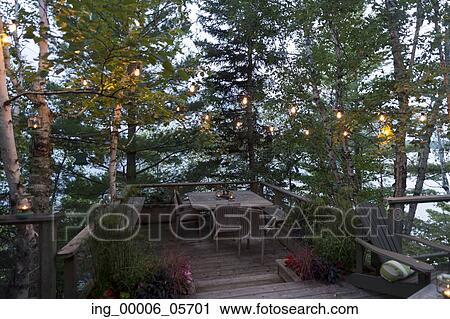 Empty table and chairs on a deck, Lake of the Woods, Ontario, Canada View Large Photo Image Stock Image - Empty table and chairs on a deck, Lake of the Woods, Ontario, Canada. Fotosearch