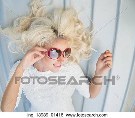 Fabulous lady with trendy sunglasses View Large Photo Image Stock Photograph - Fabulous lady with trendy sunglasses. Fotosearch
