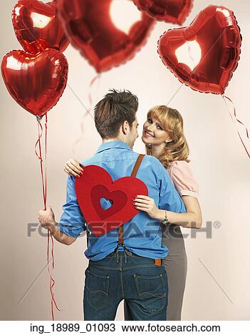 Fall in love among lots of heart balloons View Large Photo Image Stock Image - Fall in love among lots of heart balloons. Fotosearch