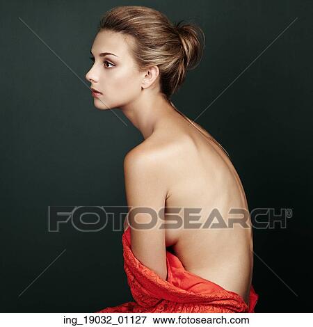 Stock Photo - Fashion portrait of beautiful woman in elegant red dress. Hair and hairstyle. Beauy vintage style. Fotosearch