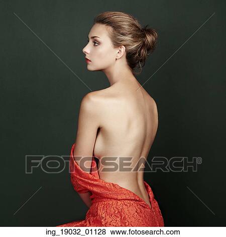 Stock Photo - Fashion portrait of beautiful woman in elegant red dress. Hair and hairstyle. Beauy vintage style. Fotosearch