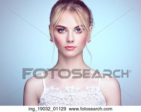 Fashion portrait of beautiful young woman with blond hair. Girl in white dress on white background View Large Photo Image Stock Photo - Fashion portrait of beautiful young woman with blond hair. Girl in white dress on white background. Fotosearch