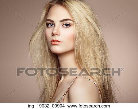 Picture - Fashion portrait of elegant woman with magnificent hair. Blonde girl. Perfect make-up. Hairstyle. Fotosearch