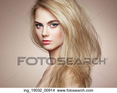 Picture - Fashion portrait of elegant woman with magnificent hair. Blonde girl. Perfect make-up. Hairstyle. Fotosearch