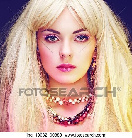 Stock Image - Fashion portrait of elegant woman with magnificent hair. Blonde girl. Jewelry. Perfect make-up. Fotosearch