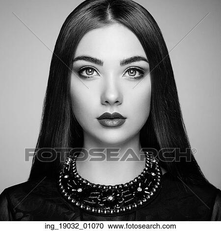 Stock Image - Fashion portrait of elegant woman with magnificent hair. Blonde girl. Perfect make-up. Black and white. Fotosearch