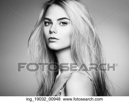 Fashion portrait of elegant woman with magnificent hair. Blonde girl. Perfect make-up. Hairstyle. Black and white View Large Photo Image Stock Photo - Fashion portrait of elegant woman with magnificent hair. Blonde girl. Perfect make-up. Hairstyle. Black and white. Fotosearch