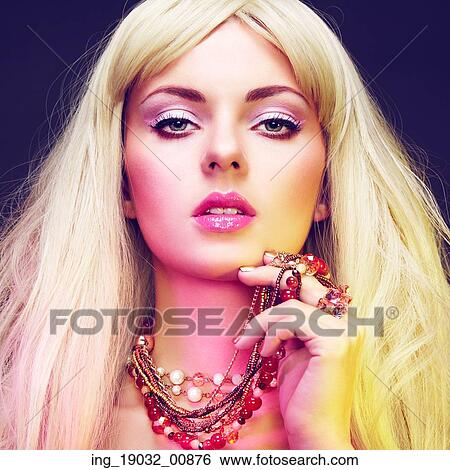 Stock Photograph - Fashion portrait of elegant woman with magnificent hair. Blonde girl. Jewelry. Perfect make-up. Fotosearch