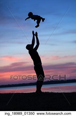 Stock Image - Father makes his child happy. Fotosearch