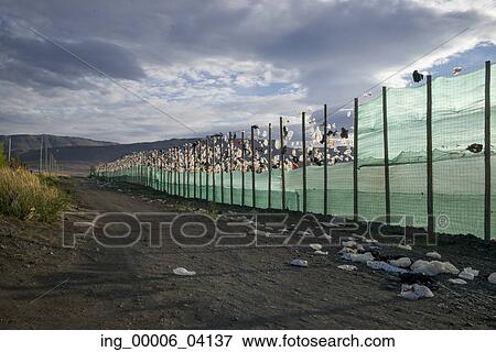 Fence along dirt road in field, Santa Cruz Province, Patagonia, Argentina View Large Photo Image Stock Photo - Fence along dirt road in field, Santa Cruz Province, Patagonia, Argentina. Fotosearch