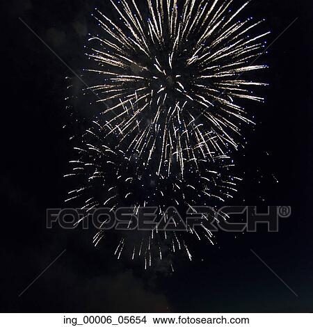 Picture - Fireworks display at night on Canada Day, Kenora, Lake Of The Woods, Ontario, Canada. Fotosearch