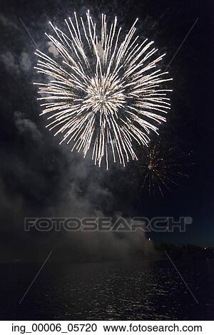 Fireworks display at night on Canada Day, Kenora, Lake Of The Woods, Ontario, Canada View Large Photo Image Stock Image - Fireworks display at night on Canada Day, Kenora, Lake Of The Woods, Ontario, Canada. Fotosearch