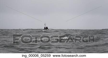 Fishermen in a boat on the Pacific Ocean, Skeena-Queen Charlotte Regional District, Haida Gwaii, Graham Island, British Columbia, Canada View Large Photo Image Stock Photo - Fishermen in a boat on the Pacific Ocean, Skeena-Queen Charlotte Regional District, Haida Gwaii, Graham Island, British Columbia, Canada. Fotosearch