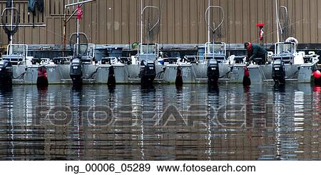 Stock Photo - Fishing boats at a dock, Skeena-Queen Charlotte Regional District, Haida Gwaii, Graham Island, British Columbia, Canada. Fotosearch