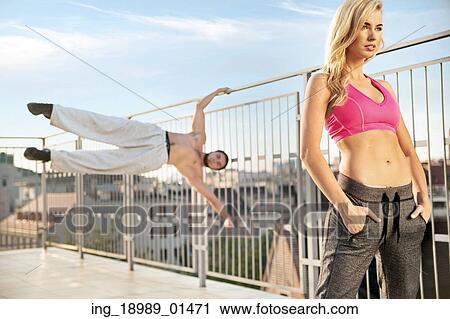 Stock Image - Fit and athletic people duirng the training. Fotosearch