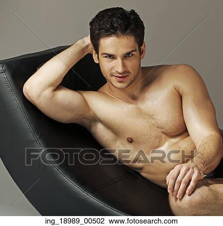 Stock Image - Fit young man relaxing after training. Fotosearch