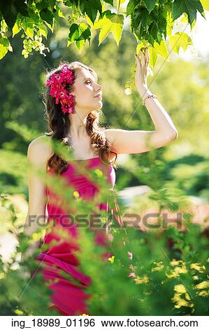 Flower nymph enjoying the greenery View Large Photo Image Stock Photograph - Flower nymph enjoying the greenery. Fotosearch