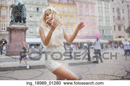 Stock Image - Funny photo of the wet blond woman. Fotosearch