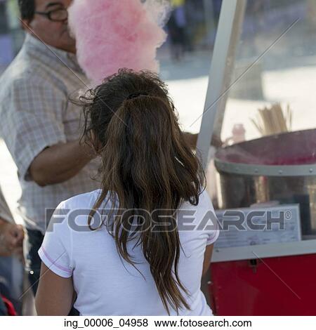 Stock Photo - Girl buying cotton candy from vendor, Santiago, Santiago Metropolitan Region, Chile. Fotosearch